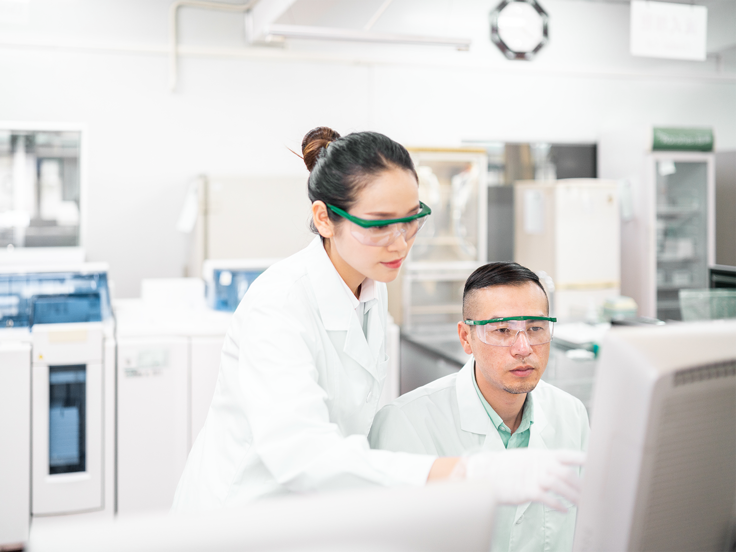 Two healthcare professionals looking at a computer