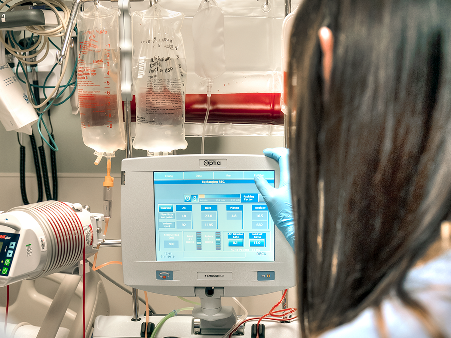 Healthcare professional looking at a screen of a device