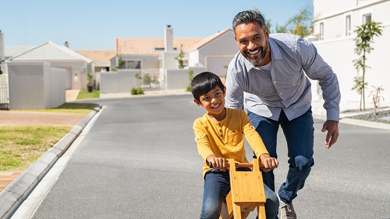 father with son riding a bike